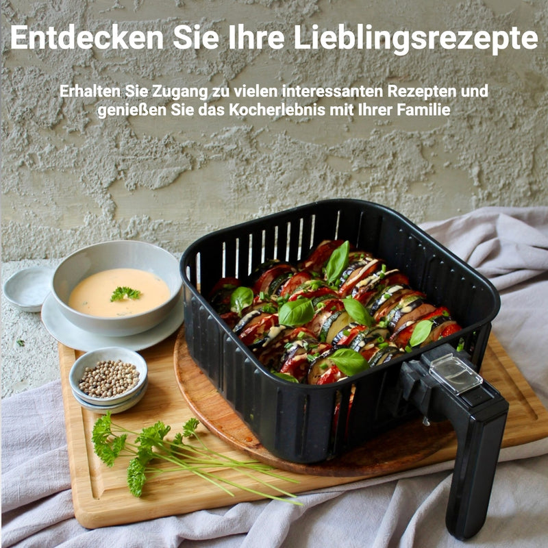 Heißluftfritteuse XL 5.5L Schwarz mit Gemüsegerichten und Dips auf Holzbrett im Hintergrund.